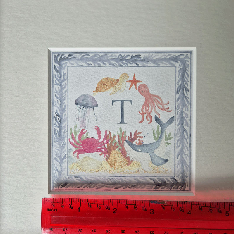 4 x 4 Design for Under the Sea print showing a blue initial mounted