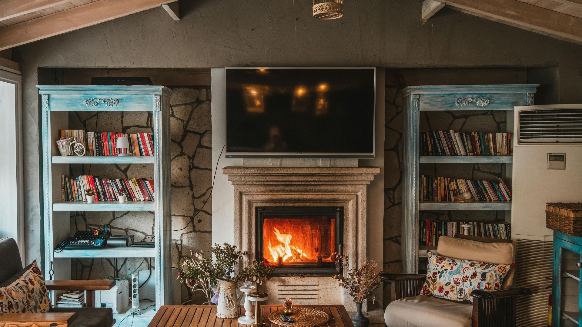 A delightful living room design with colourful bookshelves