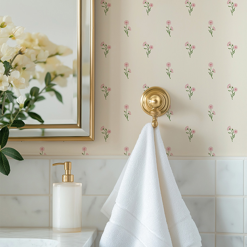 Found Flower Rose Pink floral wallpaper with small scale hand drawn flower pattern in soft pink with red accents decorates bathroom wall.
