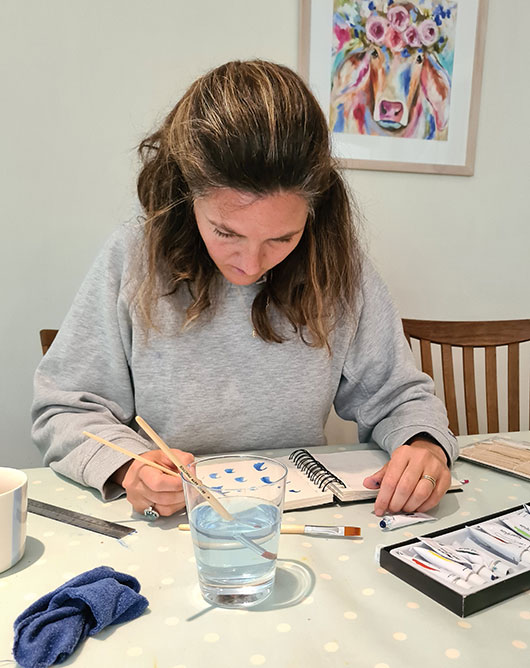 Katie painting In Kitchen